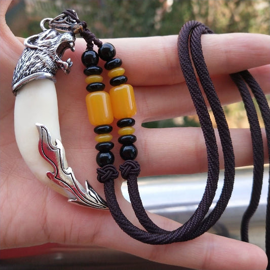 Wolf tooth pendant necklaces